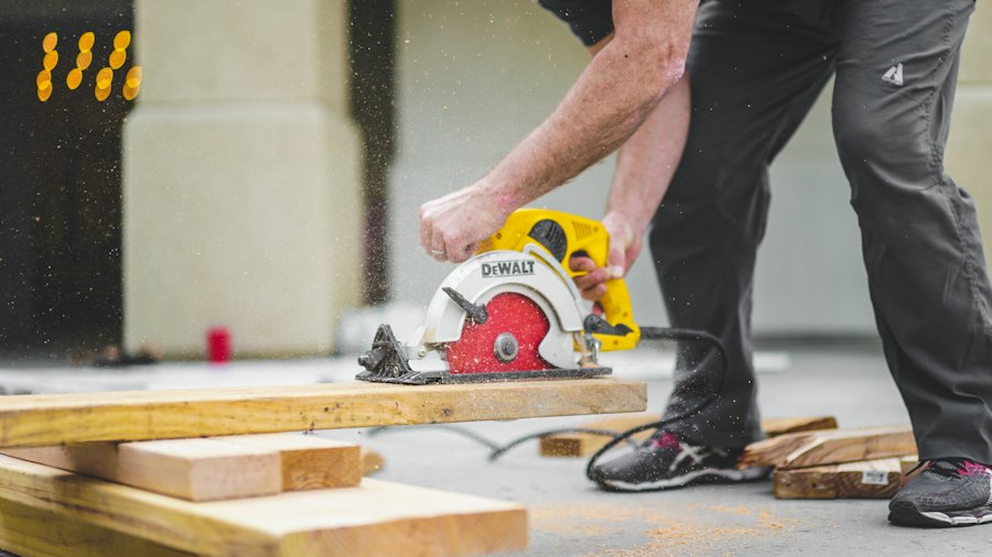 Handyman cutting wood with a circular saw