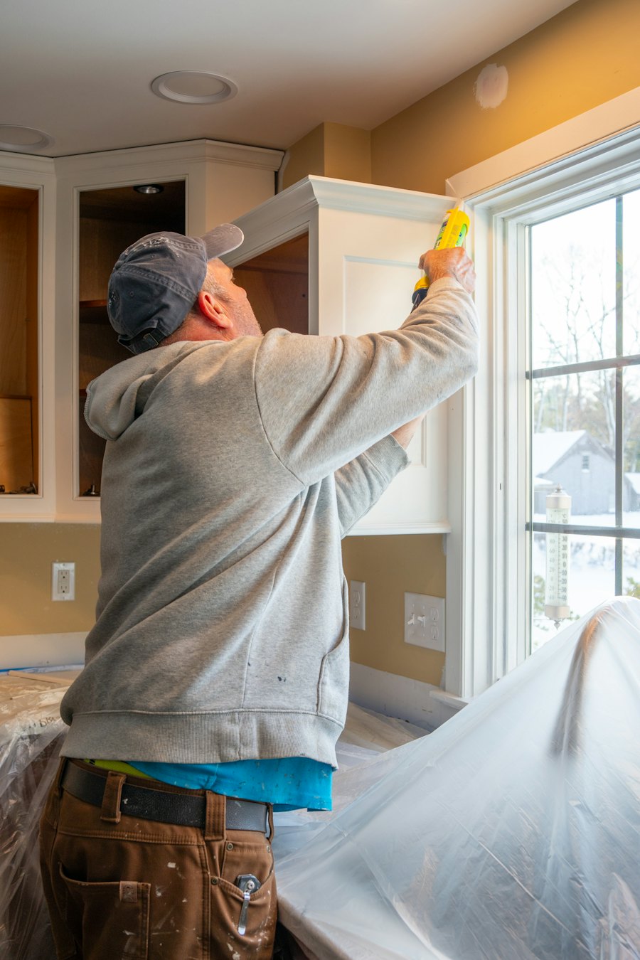 Caulking a kitchen window frame